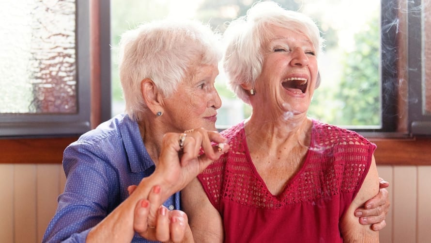 Octogenarian friends smoking medicinal marijuana together.